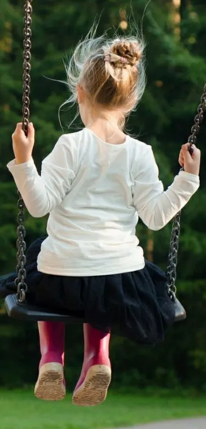 Child swinging with a forest backdrop.