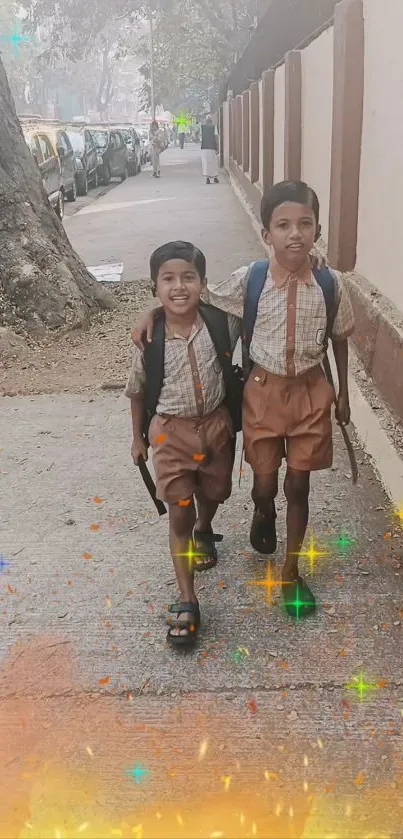 Two children in school uniforms walking together on a sidewalk.