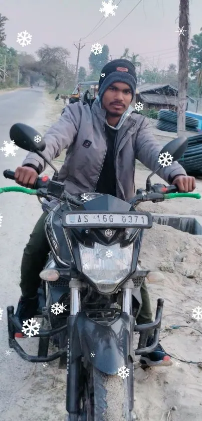 Man on motorcycle with snowflakes in winter scene.