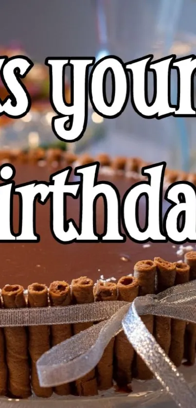Chocolate cake with a silver ribbon and birthday greeting.