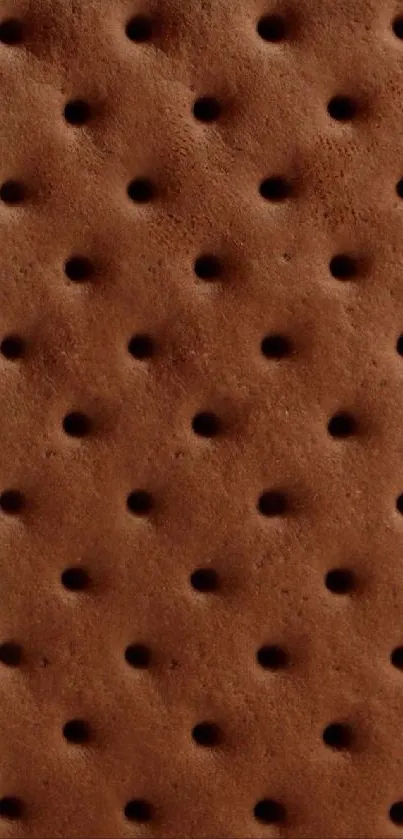 Chocolate biscuit texture with rich brown hue as phone wallpaper.