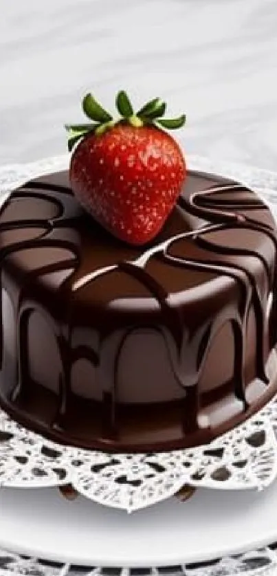 Chocolate cake with strawberry on top, perfect for dessert lovers.