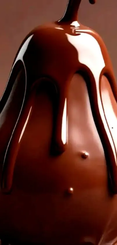 Glossy chocolate-covered pear against a smooth background.