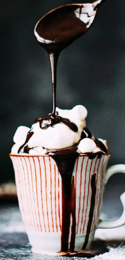 Dark chocolate syrup drips over ice cream in cup.