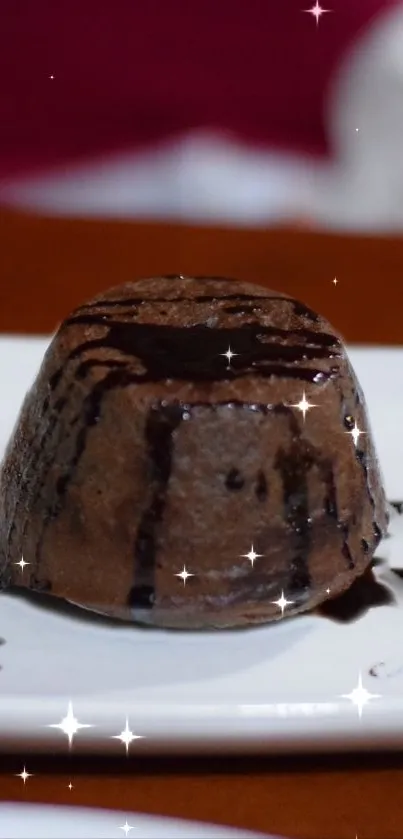 Chocolate lava cake with starry decoration on a plate.