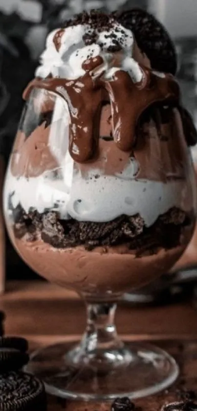 Chocolate dessert with creamy layers in a glass served elegantly.
