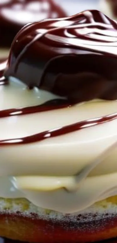 Close up of chocolate drizzle donut with creamy icing.