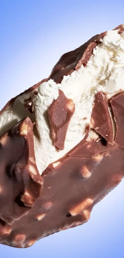 Chocolate-covered ice cream bar on a blue backdrop.
