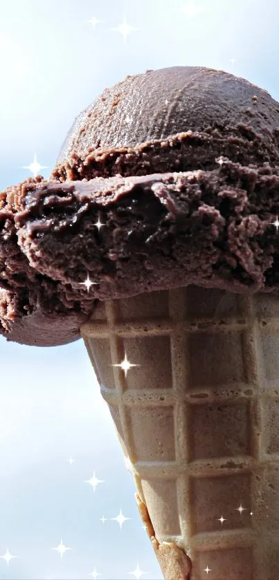 Chocolate ice cream cone against blue sky.