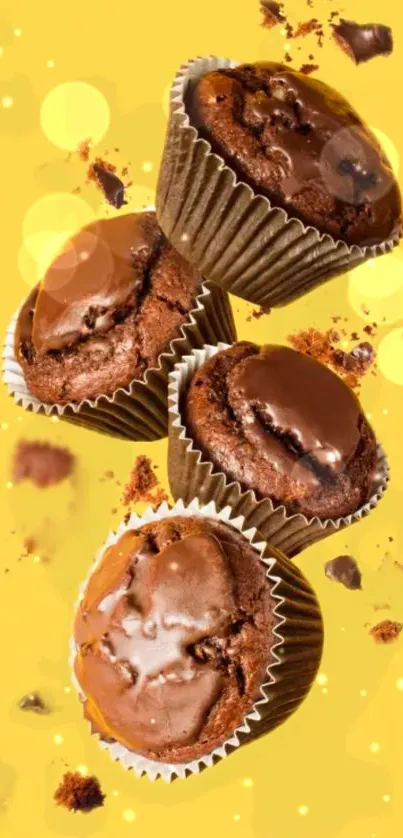 Chocolate muffins on a vibrant yellow background, perfect for dessert lovers.