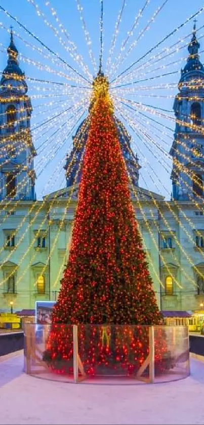 Festive Christmas street with lights and large central tree, captured at dusk.