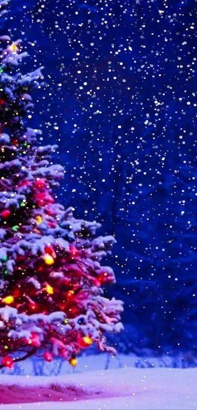 A brightly lit Christmas tree under a snowy dark blue sky.