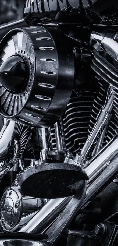 Close-up of a chrome motorcycle engine in black and white.