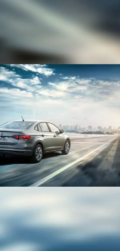 A sleek car driving on a city highway under a vibrant blue sky.