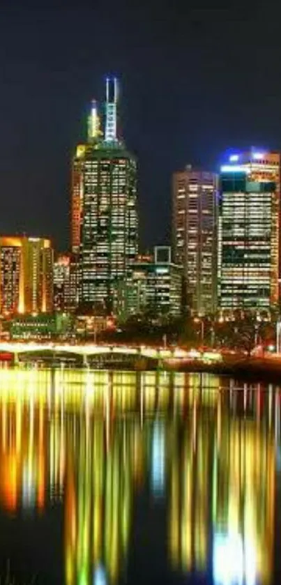 Vibrant city skyline reflecting on water at night.