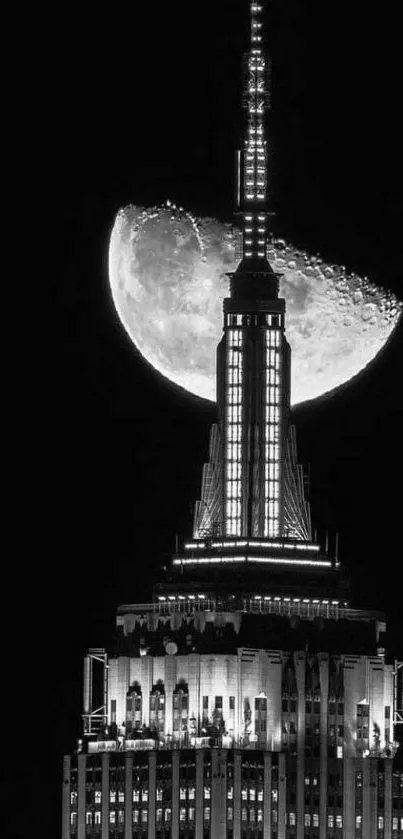 Black and white wallpaper of a city skyline with a prominent moon.