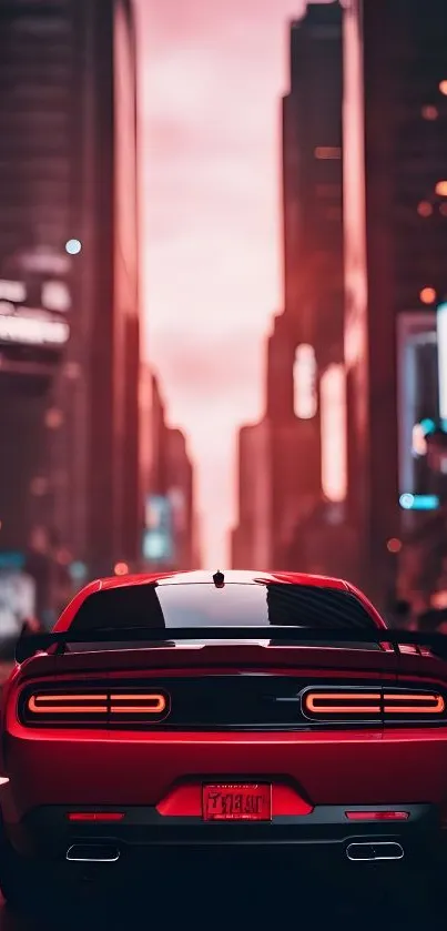 Red car in a vibrant city at night.