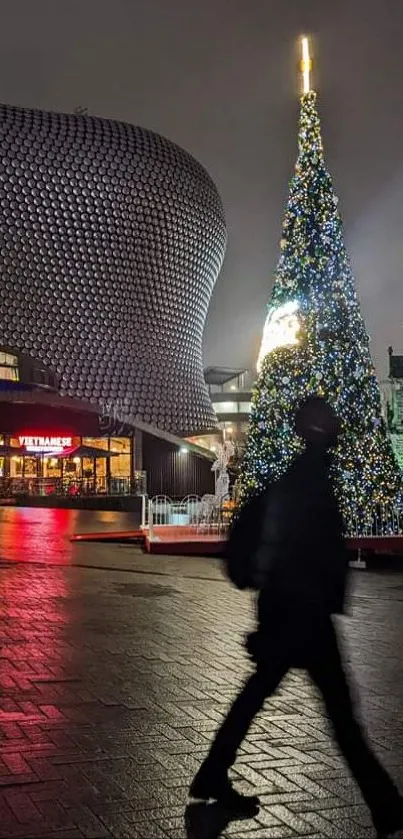 Night cityscape with Christmas tree and silhouette.