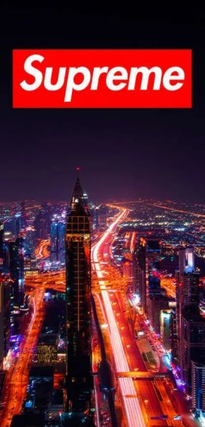 Night cityscape with neon lights and tall buildings under a dark sky.