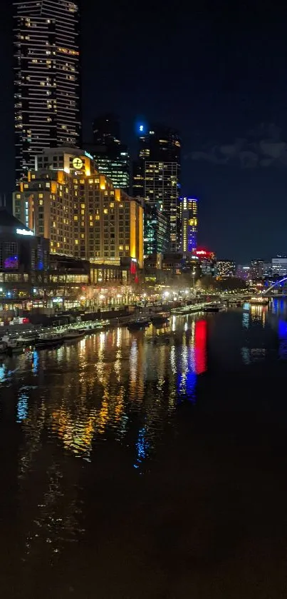 City night skyline reflected on a river with vibrant lights and tall buildings.