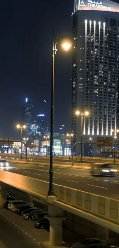 Nighttime cityscape with illuminated roads and skyscrapers.