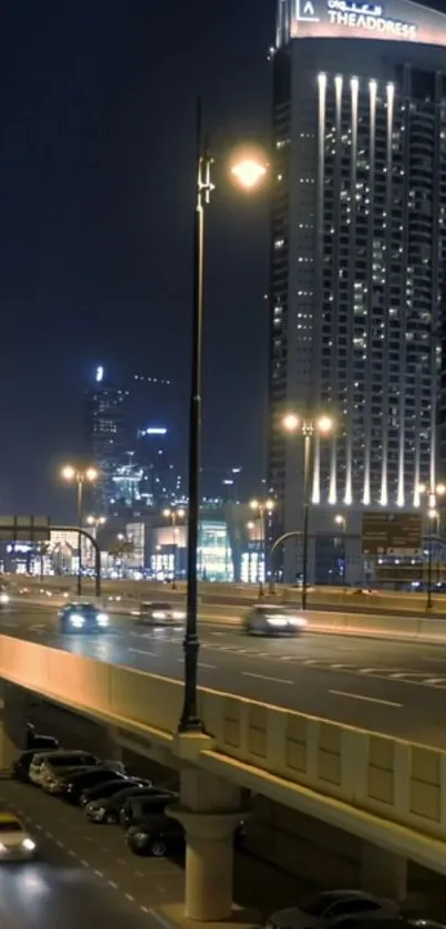 Night city skyline with lit skyscrapers and roads.