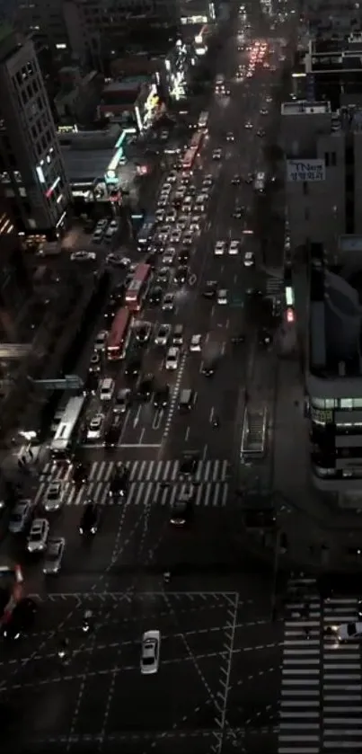 Aerial view of a city street bustling with night traffic.