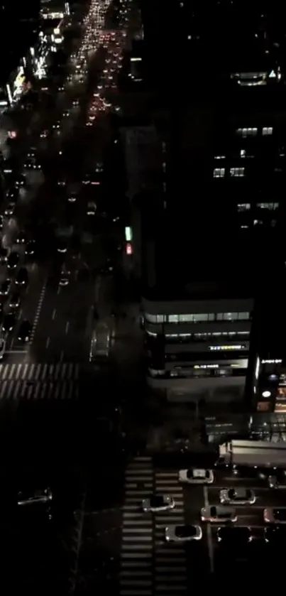 Aerial view of vibrant city traffic at night, showcasing dazzling lights.