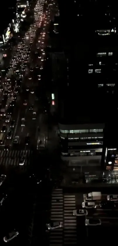 Aerial view of city night traffic with illuminated streets.