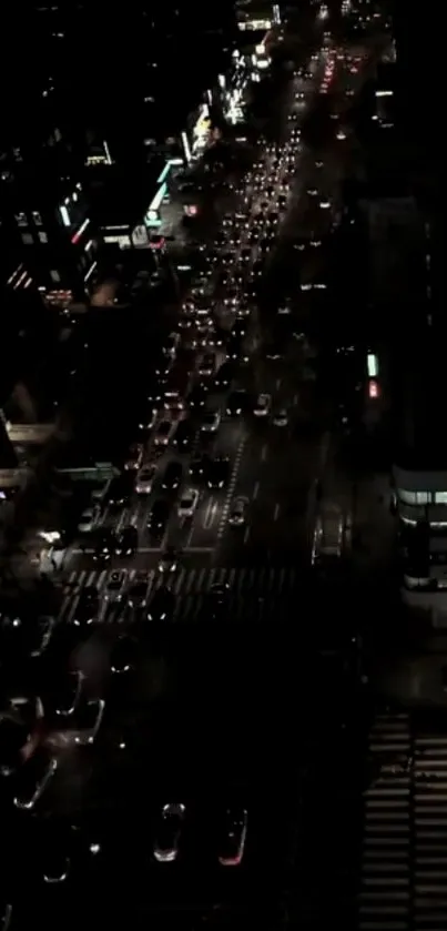 Aerial view of city traffic lights at night.