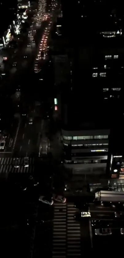 Nighttime cityscape with bright streetlights and busy roads.