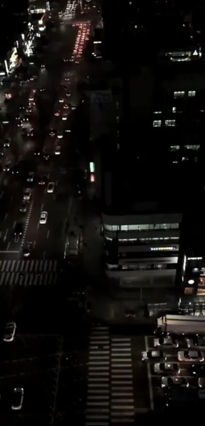 A vibrant city street view at night with illuminated buildings.