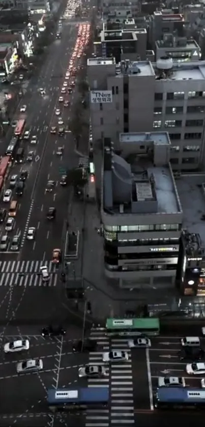 Aerial view of urban nightscape with busy city streets.