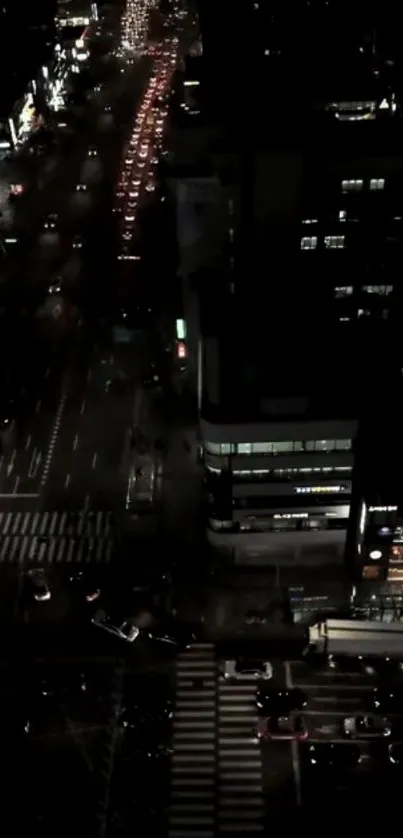 Nighttime urban cityscape with bustling traffic.