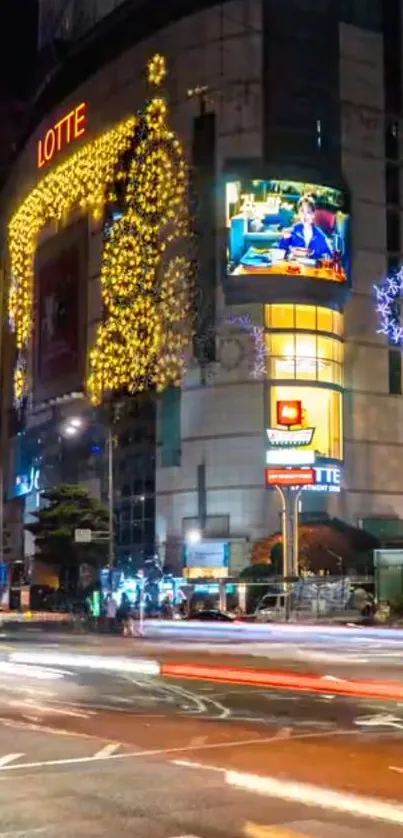 Vibrant city nightscape with illuminated buildings and moving traffic.