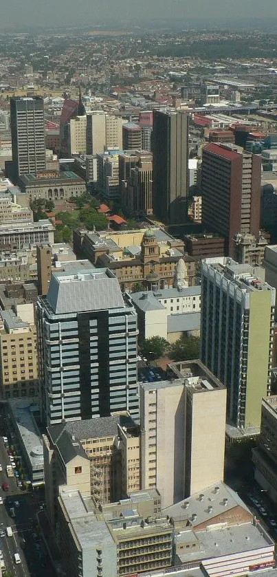 Aerial view of a bustling urban city skyline with various buildings.