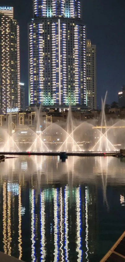 Night city skyline with reflections on water.