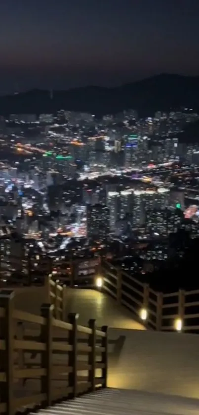 Beautiful city skyline at night with bright lights from elevated path.