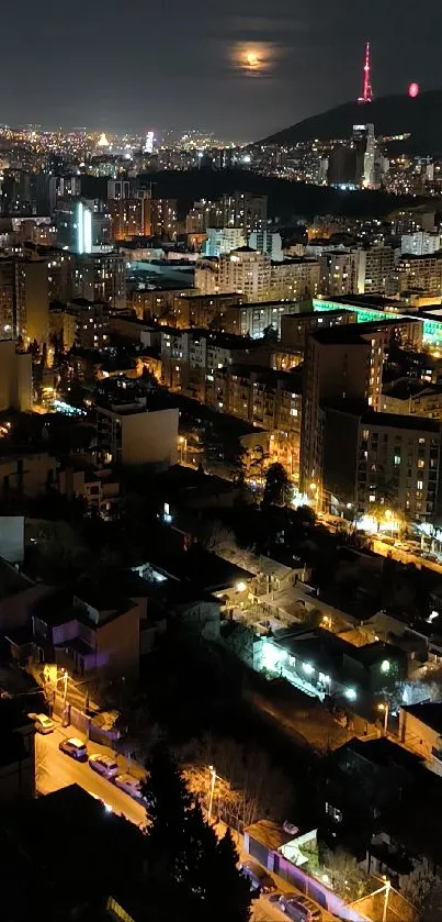 Night view of a vibrant city skyline with illuminated buildings.