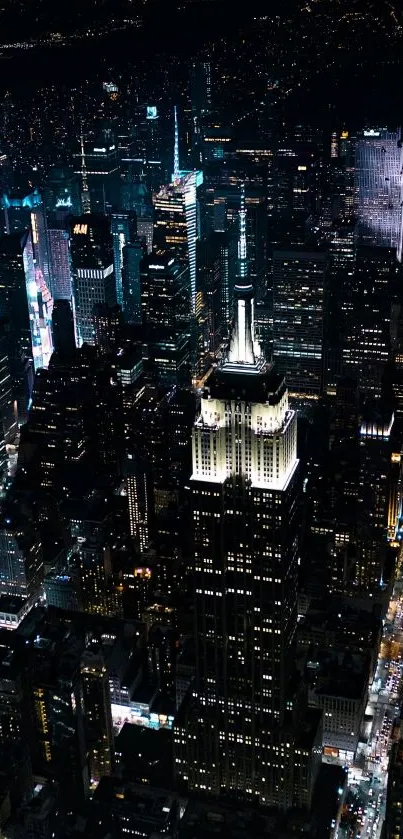 Aerial nighttime city skyline with glowing skyscrapers.