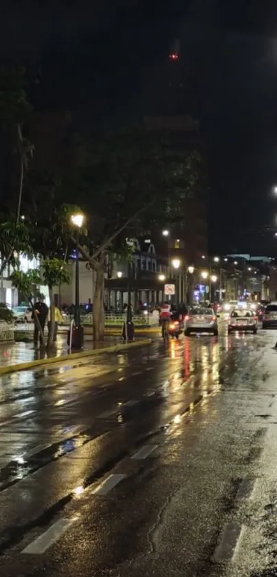 Nighttime city street with wet surface and glowing streetlights.