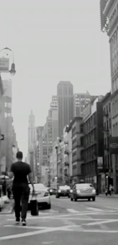 Black and white street view of city buildings and pedestrians.