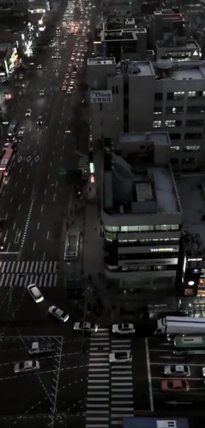 Aerial view of city streets at night with traffic and lights