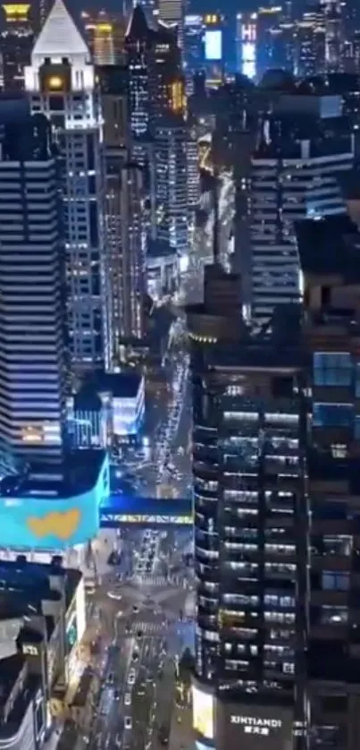 Night view of illuminated cityscape with skyscrapers.