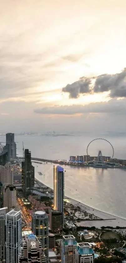 Sunset over city skyline with ocean view and ferris wheel.