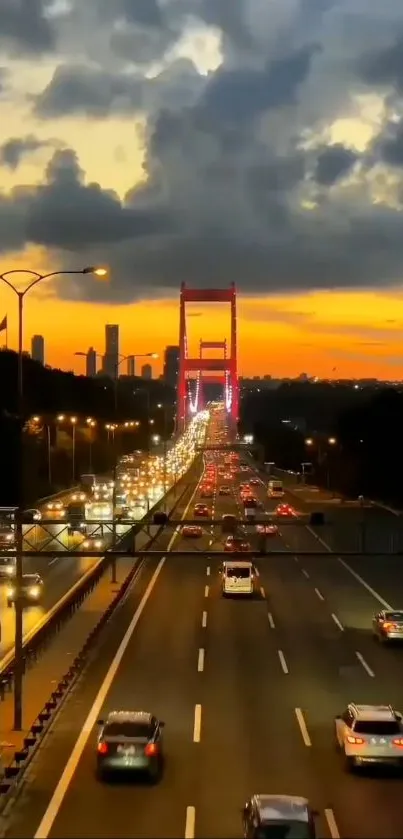 Red bridge at sunset with city traffic and a dramatic skyline.