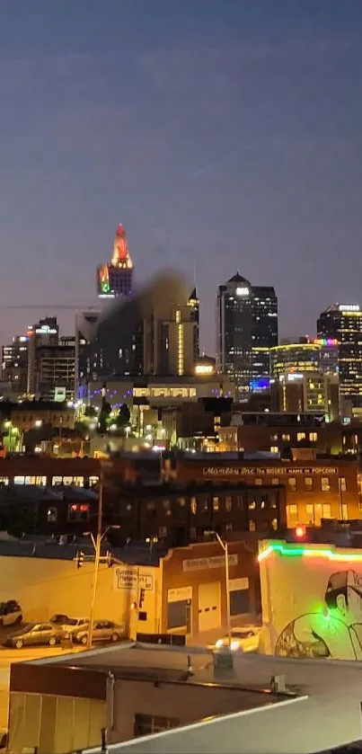 Evening cityscape with skyline and colorful lights against a dusky sky.