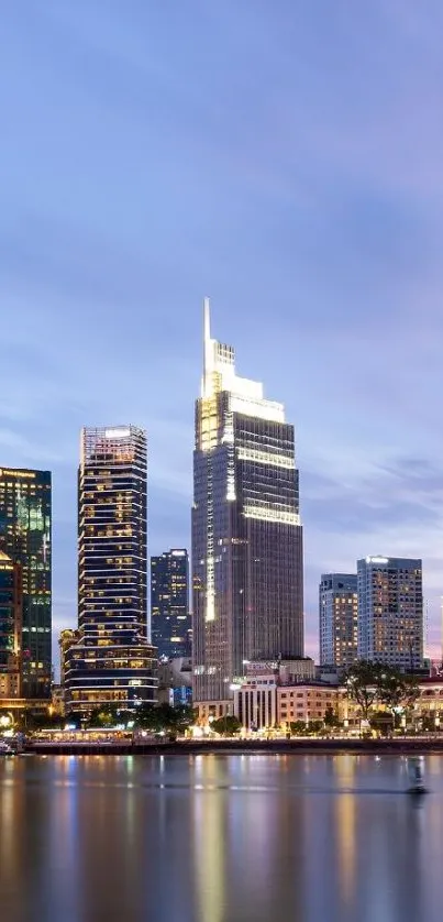 A picturesque evening city skyline with reflective water below.