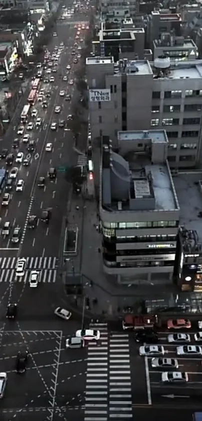 Aerial view of city traffic and buildings in the evening.