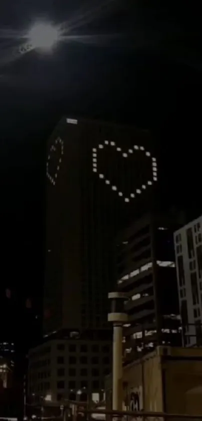 Night cityscape with heart-shaped building lights.